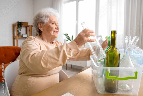 Senior woman with container...