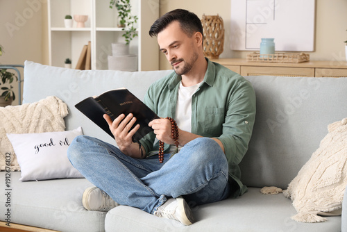 Religious man reading Holy ...