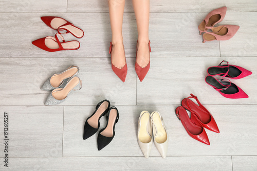 Woman's legs among high hee...