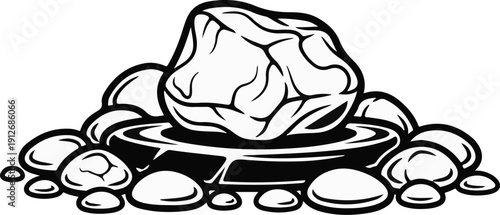 A central stone is balanced on a dark, flat surface surrounded by other rocks