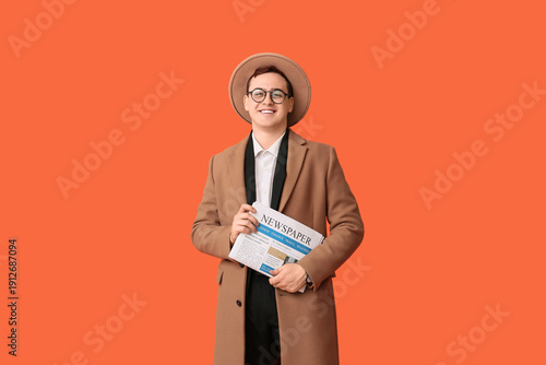 Young man in hat, coat and ...