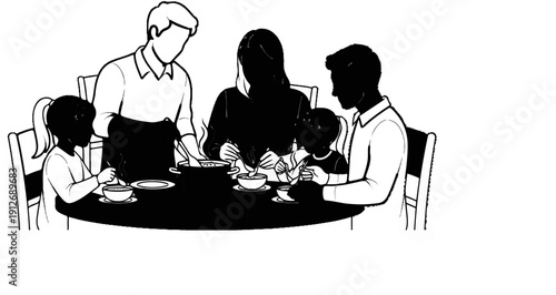 A family of four enjoys a warm meal together at a round table
