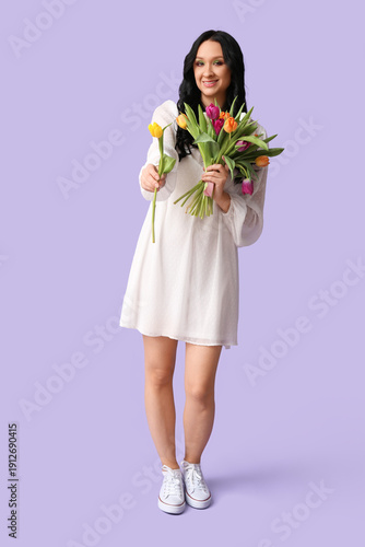 Happy young woman with bouq...