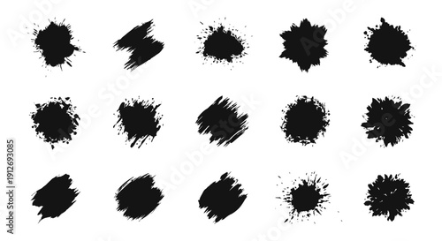 black ink splatters and textured brush strokes forming abstract grunge shapes on white useful as graphic design elements.