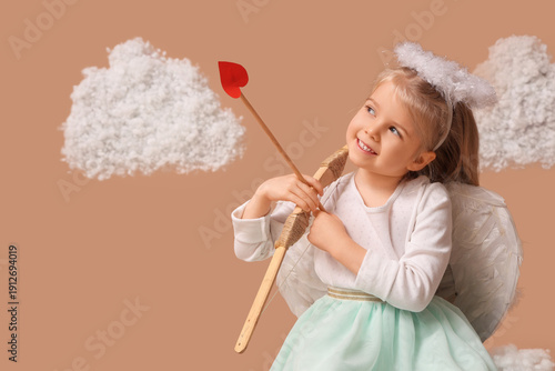 Cute little girl dressed as...