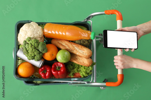 Woman with mobile phone pus...