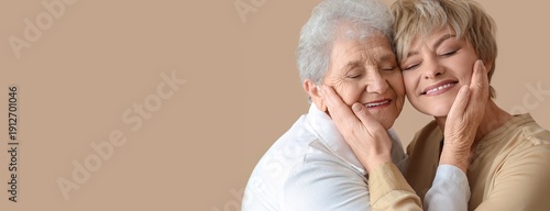 Happy woman and her senior ...