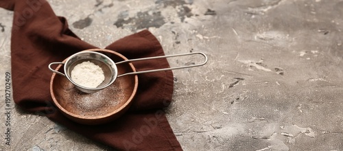 Metal sieve with flour in w...