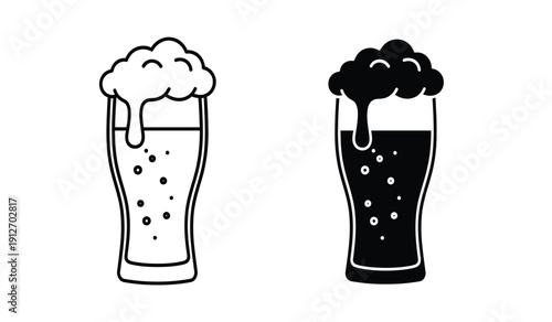 Two glasses of beer one light and one dark with foam on top