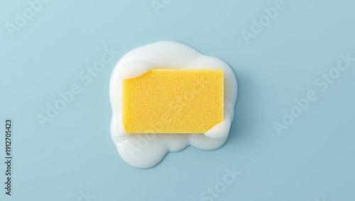 Wallpaper Mural Foamy yellow sponge on a light blue backdrop Torontodigital.ca