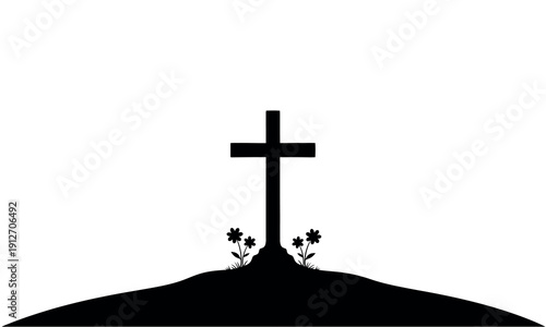 Silhouette of a cross on a hill with flowers