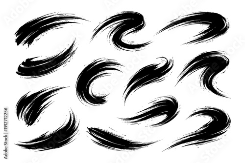 Abstract black brush strokes set on white background.