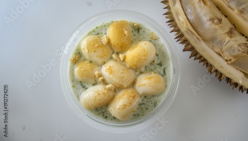 Cendol Durian is a well-known Malaysian dessert made with durian and features rice flour jelly, coconut milk, and sugar syrup