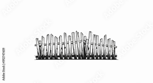 A rustic, uneven wooden fence with grassy growth at its base