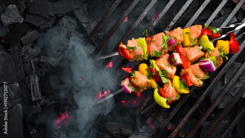 Schilderij op canvas Raw Chicken Skewers with Vegetables on a grill grate, over hot charcoal