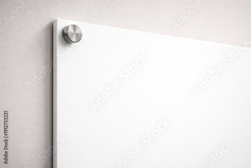 Φωτογραφία Close-up of a blank white panel mounted on a wall with a metal standoff