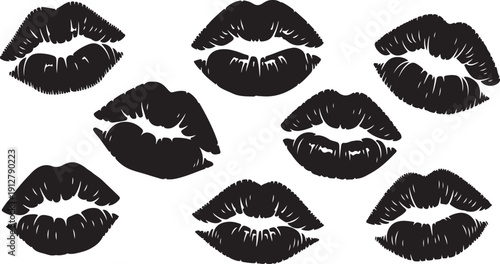 Collection of black lipstick kiss marks on white background