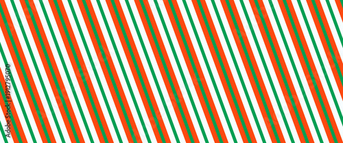 Christmas seamless pattern. Red and green diagonal stripes background. Candy cane repeating decoration wallpaper. Winter holiday lines backdrop. Xmas peppermint package wrapping print design. Vector