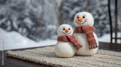 Handcrafted Crochet Snowman Group with Colorful Scarves Posed on Fluffy White Against Blurred Snow View - Ideal Cozy Winter Decor Stock Photo for Crafters.