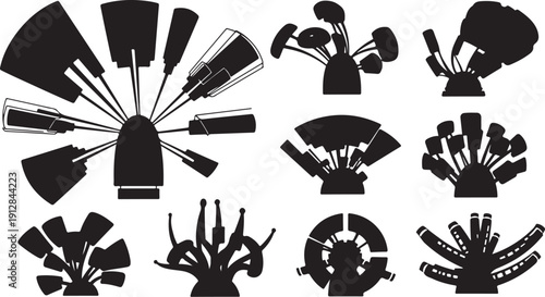 Collection of makeup brushes in black silhouettes on white