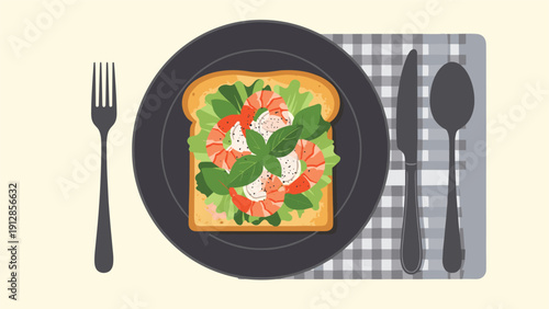 Top down view of a plate with shrimp and basil avocado toast served with a fork and knife on a checkered napkin.