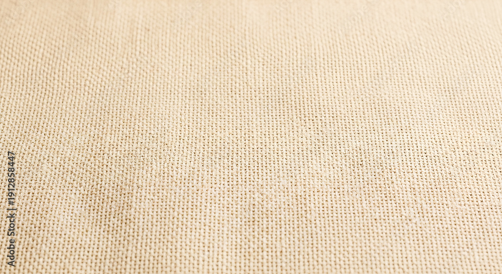 Fototapeta premium Close-up view of a woven fabric with a subtle textured pattern.