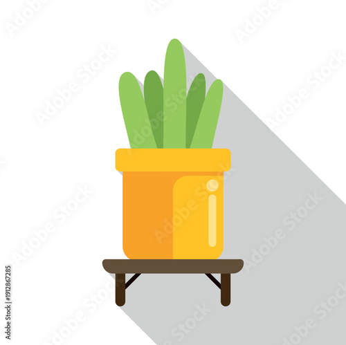 Green plant in yellow pot on brown shelf with long shadow