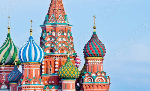 Domes of the Cathedral of Vasily the Blessed (Saint Basil's Cathedral)  against blue sky. Close-up. Early evening. Red square. Moscow. Russia
