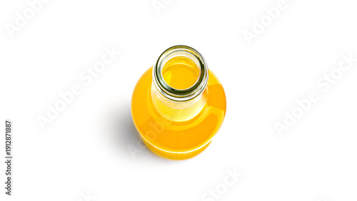 Φωτογραφία Opened bottle of yellow drink on a white background