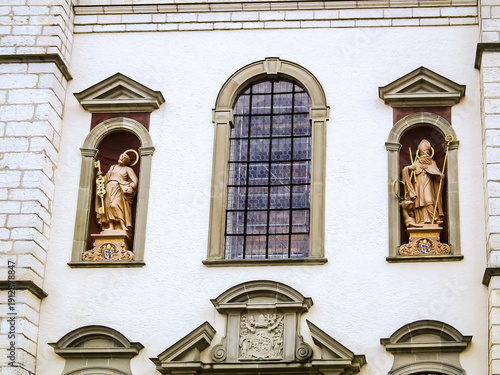 Wallpaper Mural Stone statues of saints stand in niches on the wall of Rhine Abbey in Rheinau Switzerland Torontodigital.ca