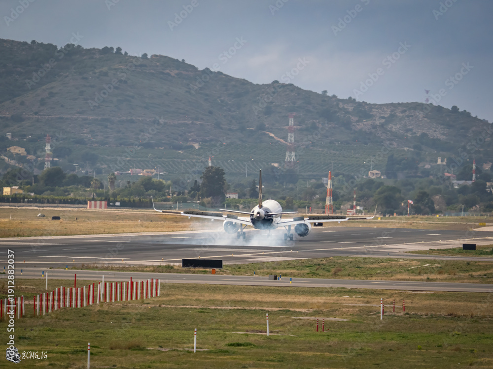 Fototapeta premium Planes landing and taking off from Manises Airport (Valencia, Spain) on February 7, 2026