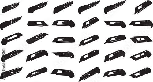 Collection of various black utility knives on white background