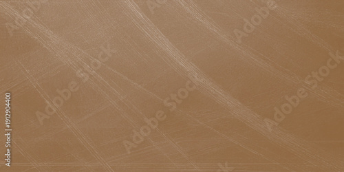 An abstract nature landscape featuring the textured surface of dry brown sand dunes where wind creates a natural ripple pattern across the desert summer beach