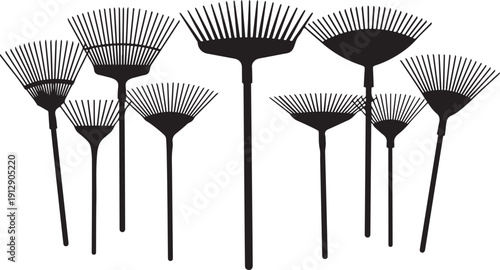 Collection of black rakes with fan-shaped heads isolated white