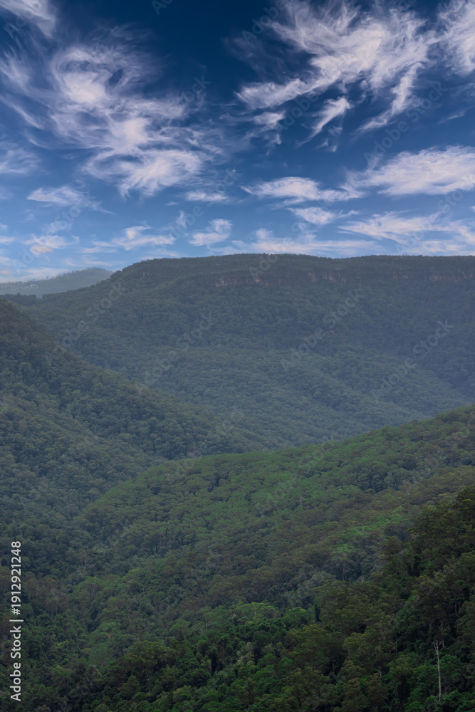 Fototapeta premium Beautiful flowing River in Fitzroy water Falls in Bowral NSW Australia beautiful colourful cloudy skies lovely waterfalls