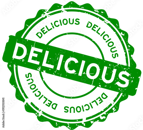 Grunge green delicious word round seal stamp on white background