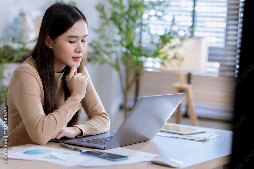 Fototapeta premium Business woman at desk in office for celebration of goals or target. Computer, smile and success with happy employee in workplace for achievement or milestone