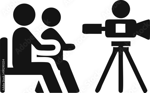 Two individuals are professionally filmed by a camera on a tripod for an interview or broadcast session