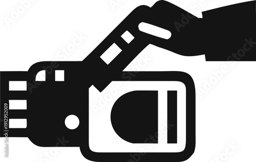 Hand inserting a USB flash drive into a port for data transfer and storage