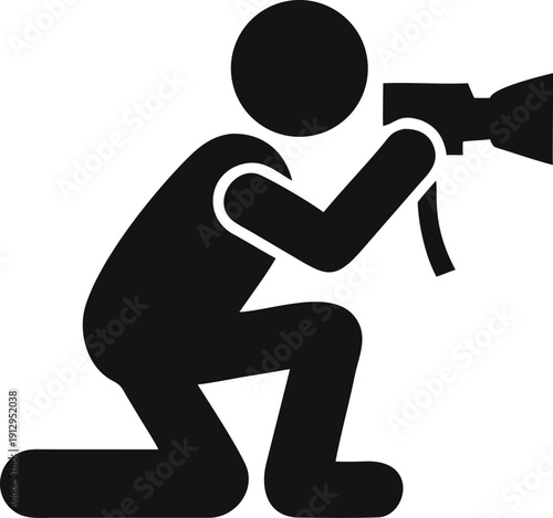 Silhouette of a kneeling person aiming a professional camera, ready to take a picture