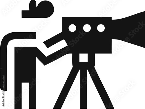 Professional filmmaker operating a sophisticated video camera on a tripod for a creative production project