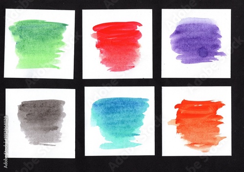 A selection of six watercolour swatches in white squares on a black background.