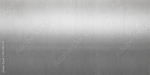 A smooth silver brushed metal plate background features a shiny stainless steel texture with a polished metallic grey pattern on a seamless aluminum surface backdrop