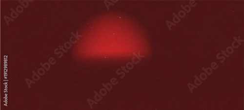 Dark red background with subtle highlight effect. The spotlight creates a gradation from bright red in the center to dark red at the edges. The background has a bit of a rough texture.