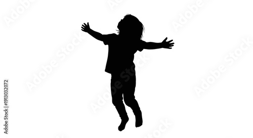 Silhouette of a Child Jumping Freely.