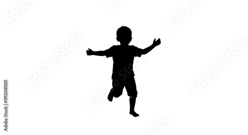 Silhouette of Happy Young Boy Jumping Freely.