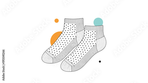 Pair of trendy ankle socks with a black polka dot pattern and colorful abstract shapes in the background for fashion apparel.
