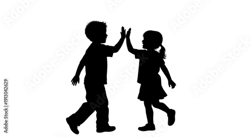 Silhouette of Children High Fiving Each Other.