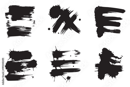 Distressed black paint strokes and grunge brush marks for artistic backgrounds and textured design work