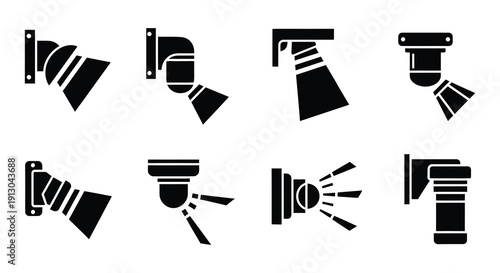 Collection of black silhouette spotlight and floodlight icons in various angles